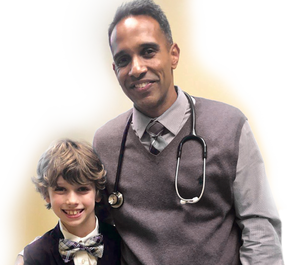Dr. Chacko with a young Chacko Allergy, Asthma and Sinus Center patient